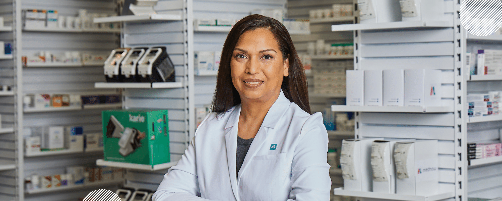 What can a Canadian pharmacist do for you? A Mednow pharmacist in a white lab coat stands in front of stocked pharmacy shelves